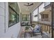 Relaxing covered patio with comfortable seating, outdoor furniture, and natural light at 3945 Plainview Rd, Charlotte, NC 28208