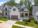Beautiful two-story home with white siding, black trim, and a two-car garage at 3945 Plainview Rd, Charlotte, NC 28208