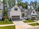 Attractive two-story home with white siding, black trim, and well-maintained landscaping at 3945 Plainview Rd, Charlotte, NC 28208