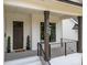 View of front porch with number and black railings at 3945 Plainview Rd, Charlotte, NC 28208