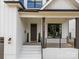View of front porch with number and black railings at 3945 Plainview Rd, Charlotte, NC 28208