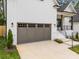Close up of attached garage with gray doors at 3945 Plainview Rd, Charlotte, NC 28208