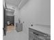 Well-lit laundry room with modern cabinets, quartz countertop, and a convenient sink for easy chores at 3945 Plainview Rd, Charlotte, NC 28208