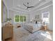 Spacious main bedroom with large windows, tray ceilings, and seating area at 3945 Plainview Rd, Charlotte, NC 28208