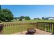 Outdoor deck with fire pit overlooking a large, grassy backyard, perfect for entertaining or relaxing in nature at 402 Beaver Dam Church Rd, Shelby, NC 28152