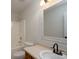 Bathroom showcasing a vanity with white countertop, updated fixtures, and a shower with a handheld showerhead at 402 Beaver Dam Church Rd, Shelby, NC 28152