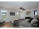 Virtually staged bedroom with hardwood floors, king-size bed, neutral colors, and natural light from multiple windows at 402 Beaver Dam Church Rd, Shelby, NC 28152