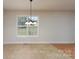 Dining room featuring tile floors and a view of the backyard at 402 Beaver Dam Church Rd, Shelby, NC 28152