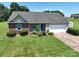 Beautiful single-story home with a well-maintained lawn, landscaping, and a two-car garage at 402 Beaver Dam Church Rd, Shelby, NC 28152