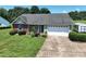 Charming single-story home with a well-manicured lawn, landscaping, and a convenient two-car garage at 402 Beaver Dam Church Rd, Shelby, NC 28152