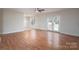 Spacious living room with hardwood floors and glass doors that lead to a patio at 402 Beaver Dam Church Rd, Shelby, NC 28152