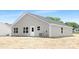 The backyard features a gray exterior and a cozy patio at 4474 Pebblebrook Sw Cir, Concord, NC 28027