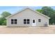 The backyard features a neutral exterior and a cozy patio at 4474 Pebblebrook Sw Cir, Concord, NC 28027