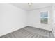 This bedroom features neutral walls and carpet, bright window, and ample natural light at 4474 Pebblebrook Sw Cir, Concord, NC 28027