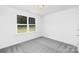 Neutral bedroom with plush carpet, window with outdoor views, and ample natural light at 4474 Pebblebrook Sw Cir, Concord, NC 28027