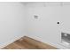 This laundry room features hardwood floors and ample space at 4474 Pebblebrook Sw Cir, Concord, NC 28027