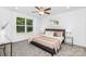 This main bedroom features an ceiling fan, and large window with natural light at 4474 Pebblebrook Sw Cir, Concord, NC 28027