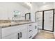 Modern bathroom featuring double sinks, granite countertops, and a glass-enclosed shower at 455 Contentment Ct # 18, Kannapolis, NC 28081