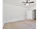 Cozy bedroom with carpet flooring, a ceiling fan, and a view of the green outdoors at 455 Contentment Ct # 18, Kannapolis, NC 28081
