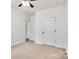 Bright bedroom featuring neutral carpet, ceiling fan, and white doors at 455 Contentment Ct # 18, Kannapolis, NC 28081