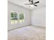 Spacious bedroom with carpet flooring, a ceiling fan, and two windows for natural light at 455 Contentment Ct # 18, Kannapolis, NC 28081