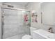 Modern bathroom featuring a glass-enclosed shower with marble-look tile and updated fixtures at 5909 Cougar Ln, Charlotte, NC 28269