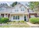 Charming townhome featuring manicured landscaping and a welcoming front entrance at 5909 Cougar Ln, Charlotte, NC 28269