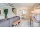 Bright open-concept living space with tile flooring and stylish decor, perfect for relaxation and entertaining at 5909 Cougar Ln, Charlotte, NC 28269