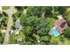 Overhead view of property with pool, mature trees, outdoor structures and surrounding neighborhood at 602 Unity St, Fort Mill, SC 29715