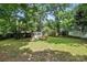 Green backyard featuring a shed, providing ample storage space at 602 Unity St, Fort Mill, SC 29715