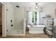 Bathroom featuring a stand alone soaking tub and tiled glass shower at 602 Unity St, Fort Mill, SC 29715