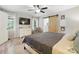 Comfortable bedroom featuring a wooden barn door, flat screen TV, and natural light at 602 Unity St, Fort Mill, SC 29715