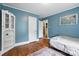 Stylish bedroom with blue walls, wood floors, and charming decor at 602 Unity St, Fort Mill, SC 29715