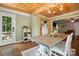Dining space offers natural lighting, a farmhouse table, and view to the porch at 602 Unity St, Fort Mill, SC 29715