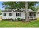 Cozy one-story home with a welcoming screened-in porch and well-maintained landscaping at 602 Unity St, Fort Mill, SC 29715