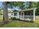 Attractive one-story home featuring a quaint, screened front porch at 602 Unity St, Fort Mill, SC 29715
