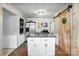 Open kitchen features an island, stainless appliances, and ample storage space at 602 Unity St, Fort Mill, SC 29715