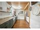 Charming kitchen featuring custom wood ceiling, updated cabinetry, and decorative wall accents at 602 Unity St, Fort Mill, SC 29715