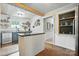 Open kitchen view with island and built-in display shelves for storage and style at 602 Unity St, Fort Mill, SC 29715