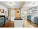 Remodeled kitchen features an island, stainless oven, and view into the dining room at 602 Unity St, Fort Mill, SC 29715