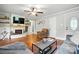 Bright living room featuring a cozy fireplace, hardwood floors, and neutral paint colors at 602 Unity St, Fort Mill, SC 29715