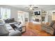Inviting living room with hardwood floors, a fireplace, and an open floor plan to dining at 602 Unity St, Fort Mill, SC 29715