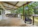 Inviting covered deck with a swing, perfect for relaxing and enjoying the outdoors at 602 Unity St, Fort Mill, SC 29715
