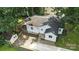 Backyard view of home with deck and storage shed; partially fenced with driveway at 602 Unity St, Fort Mill, SC 29715