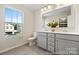 Bright bathroom with double vanity, gray cabinets, and a large window providing natural light at 626 Wabash Ave # 6, Charlotte, NC 28208
