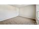 Neutral bedroom with plush carpet and a window providing ample natural light at 626 Wabash Ave # 6, Charlotte, NC 28208