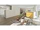 Open-concept living area with stylish furnishings, a kitchen view, and hardwood flooring at 626 Wabash Ave # 6, Charlotte, NC 28208