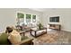 Inviting living room with hardwood floors, contemporary furniture, and large windows at 626 Wabash Ave # 6, Charlotte, NC 28208