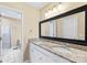 Bright bathroom featuring double sinks with granite countertops and modern lighting fixtures at 698 Normandy Rd, Mooresville, NC 28117