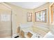 Inviting bathroom with a soaking tub, stained glass windows and a glass-enclosed shower at 698 Normandy Rd, Mooresville, NC 28117